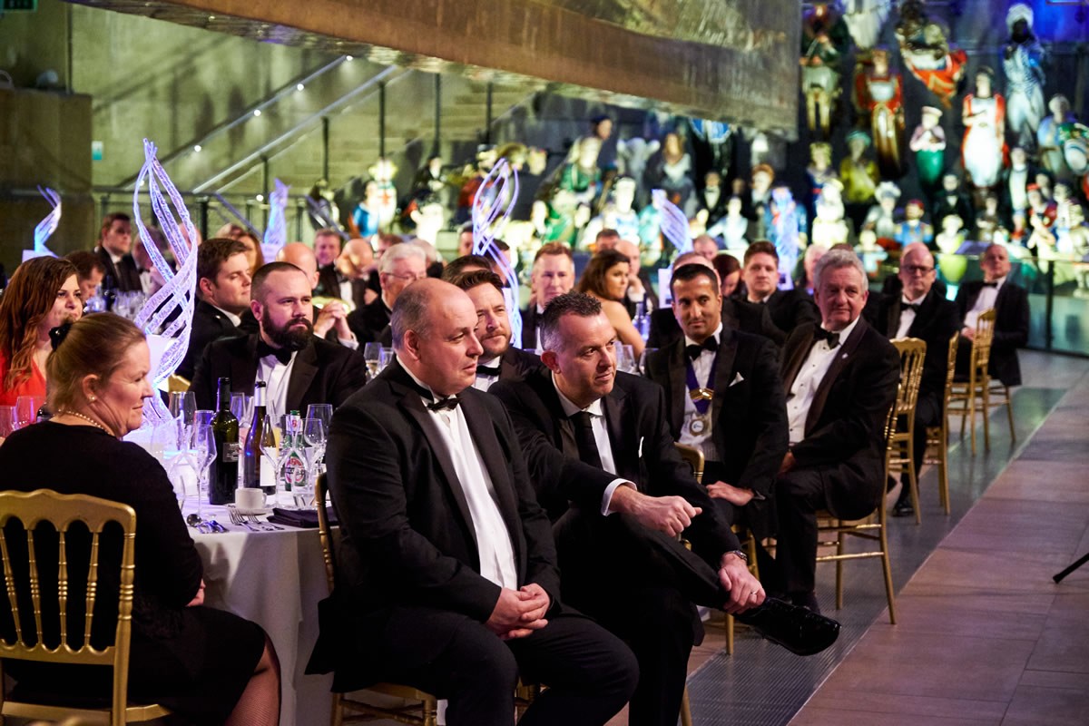 guests at a Cutty Sark event listening to guest speakers
