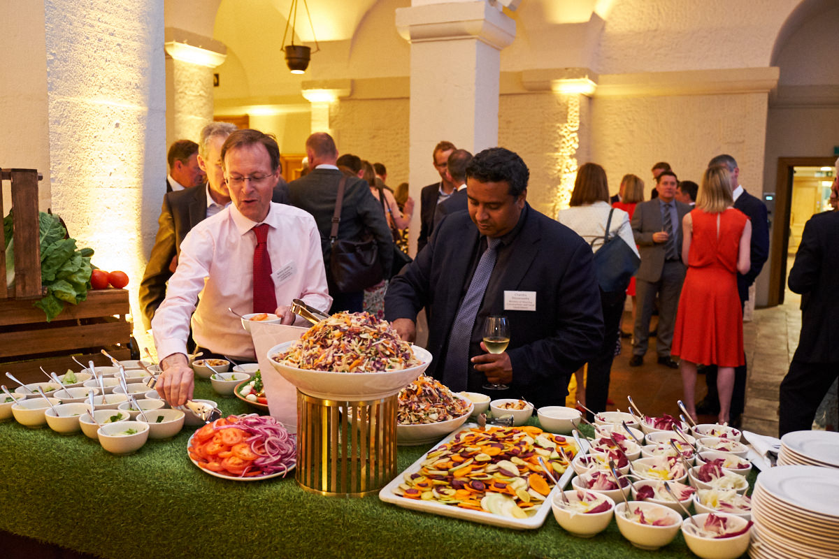 attendees choosing food at an event