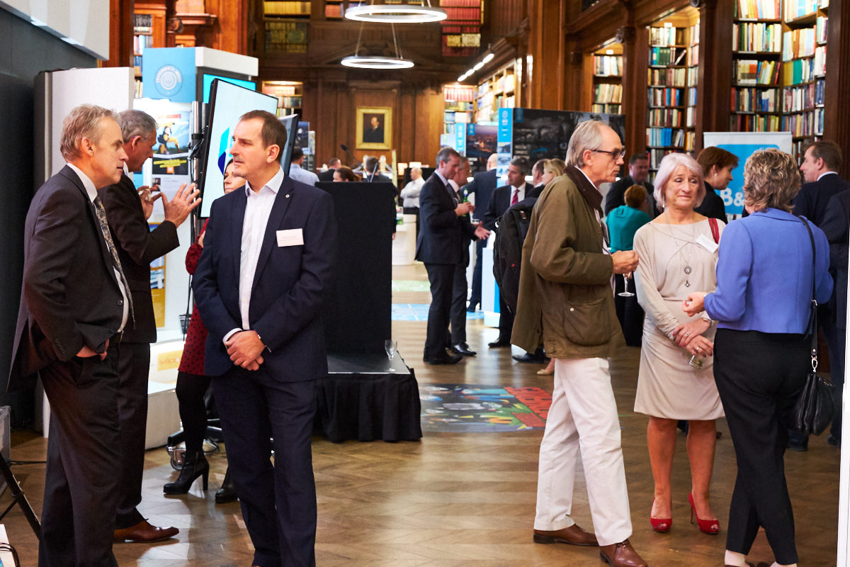 guests at a London event in the library at One Great George Street
