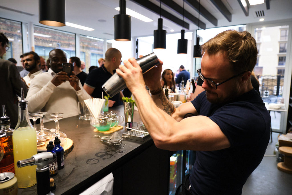 a barman mixing a cocktail at a London event